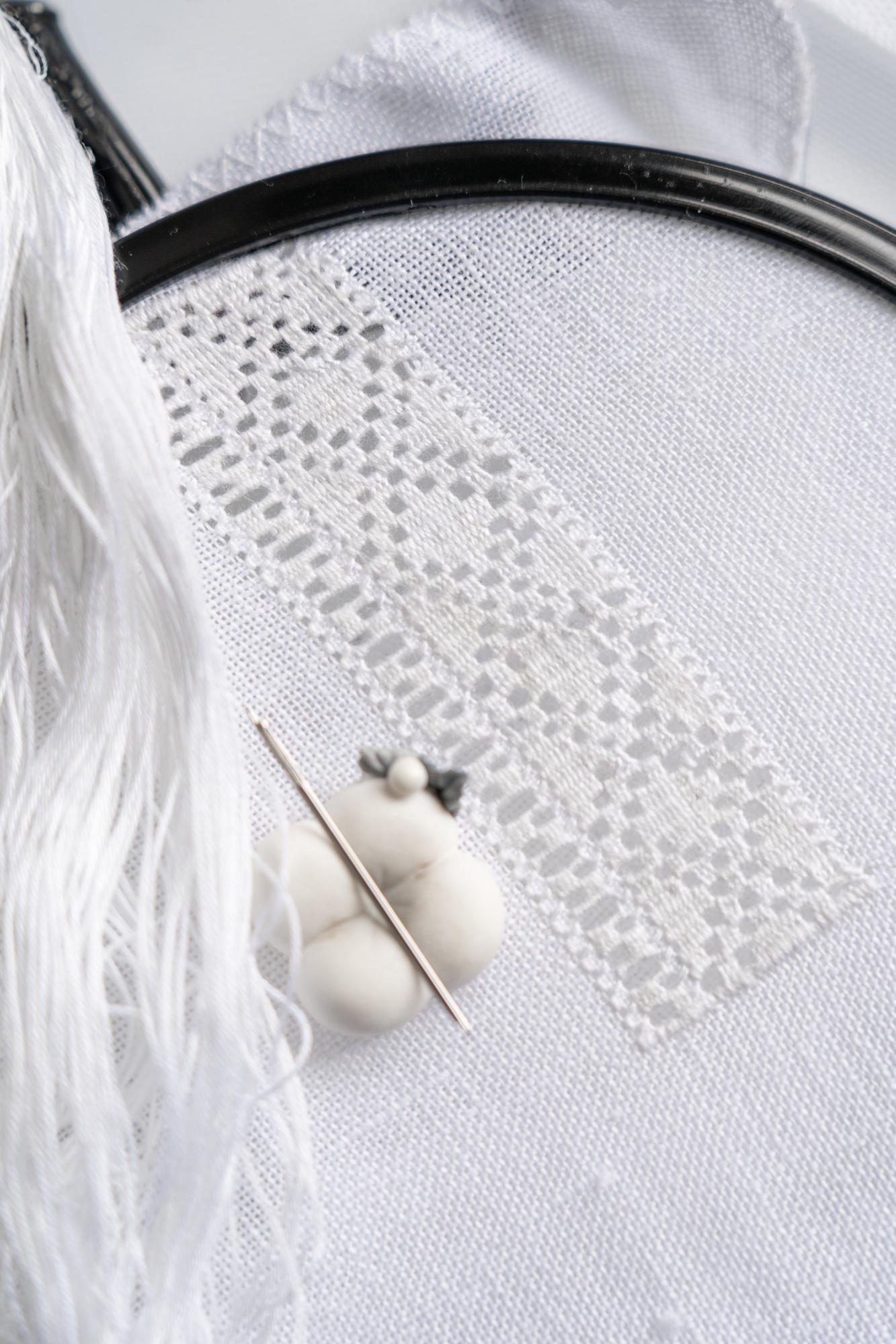 Close-up of artisan embroidery on linen